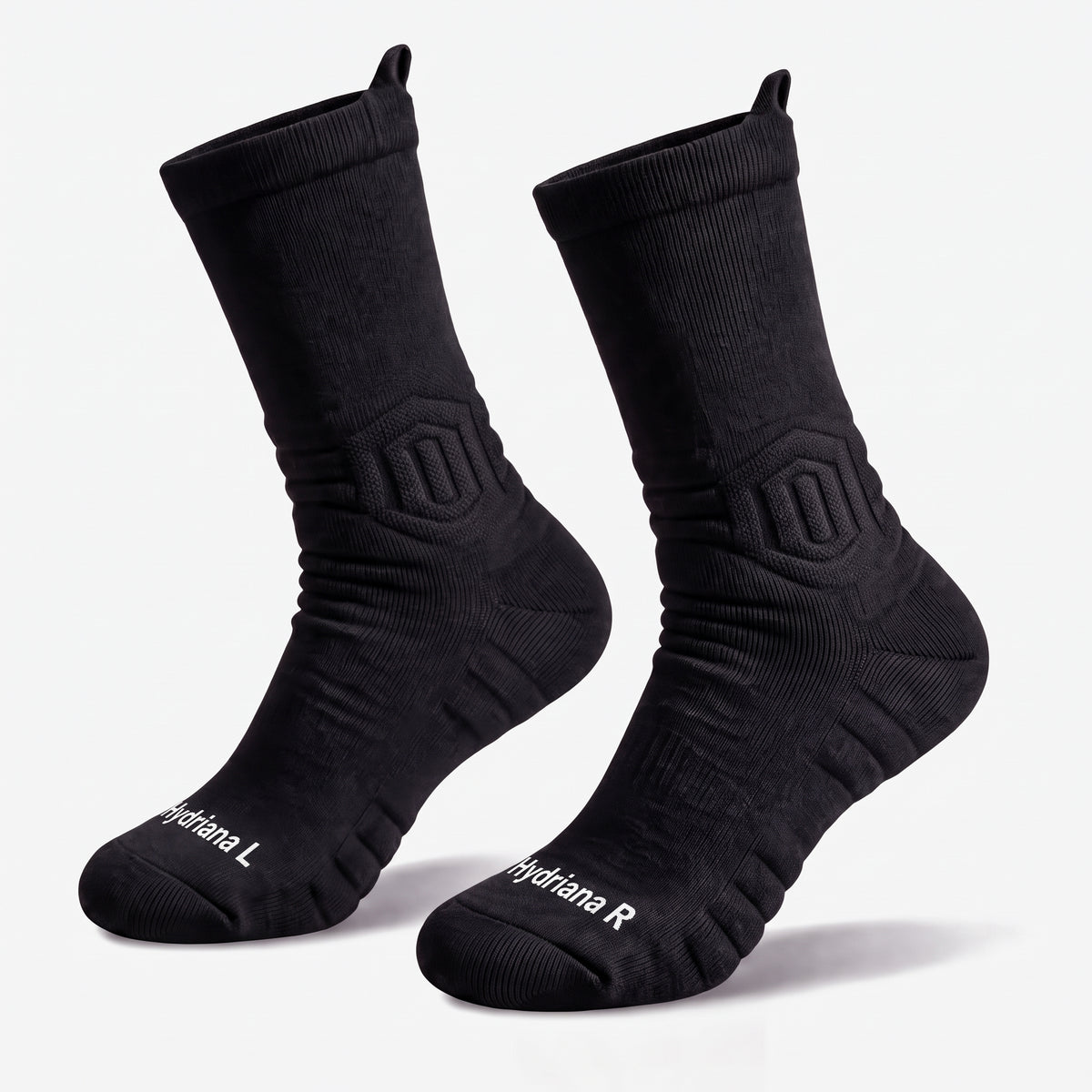 A pair of black athletic crew socks with white branding text on the toes, displayed against a clean white background.