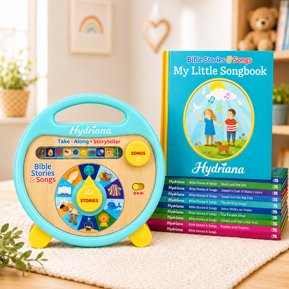 A children's Hydrana Bible Stories & Songs toy set shown in a styled indoor room. The set includes a turquoise and wood storytime speaker with a colorful dial, a hardcover songbook titled 'My Little Songbook,' and a stack of matching songbook covers in bright colors.